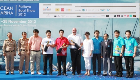 Dignitaries and event organizers pose for a group photo at the opening of the first Ocean Marina Boat Show.